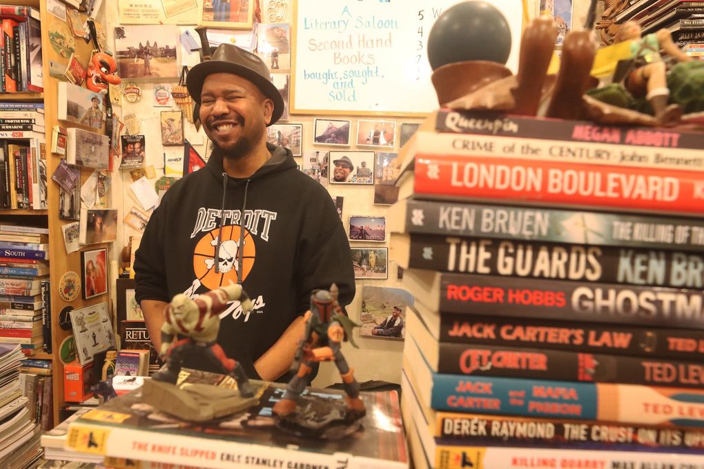 At BLMF bookstore in Pike Place Market, J.B. Johnson is the owner. Ask nicely and you’ll get the NSFW backstory behind the store’s name. (Greg Gilbert / The Seattle Times)