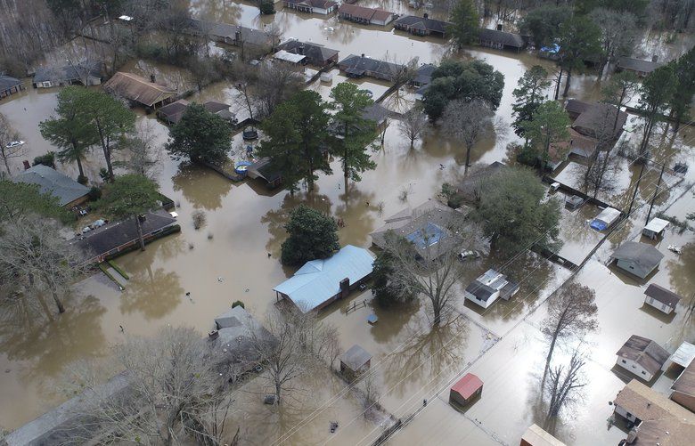A northeast Jackson, Miss. neighborhood and Harbor Pines in Ridgeland are still under a mandatory evacuation as flooding continues Monday, Feb. 17, 2020. (Barbara Gauntt/The Clarion-Ledger via AP) MSJAD101 MSJAD101