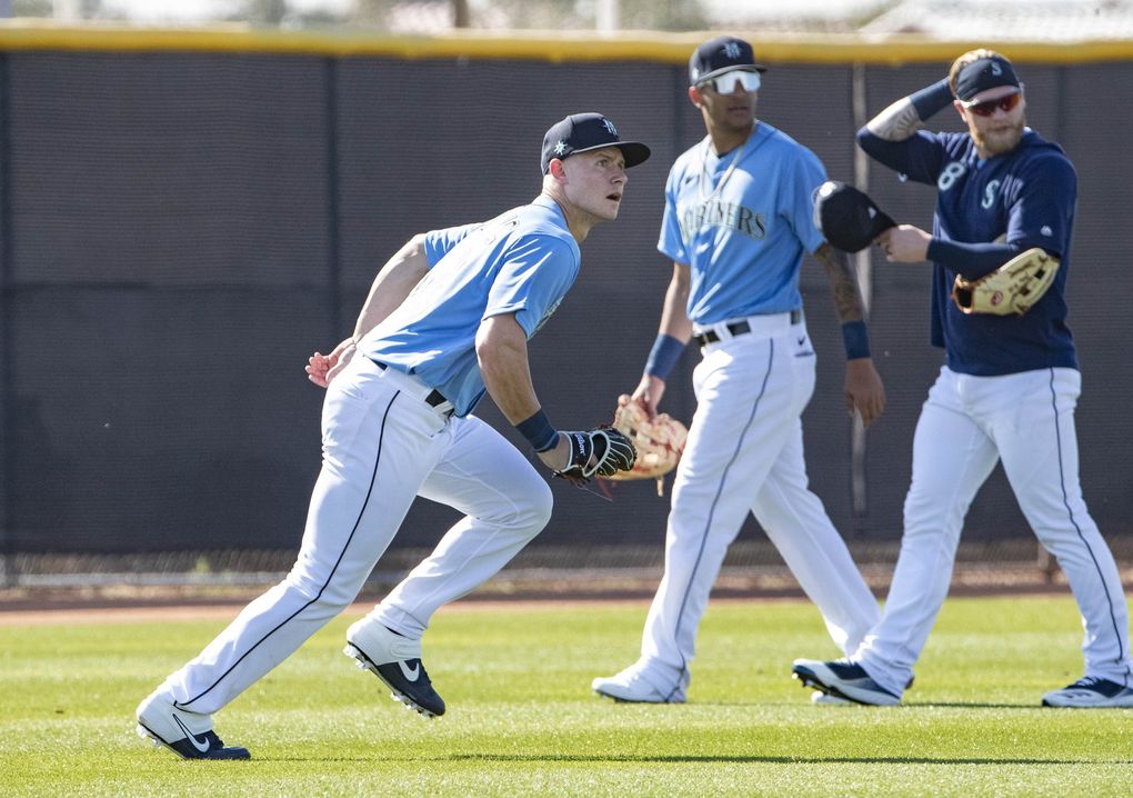 Outfielder Jarred Kelenic fields balls Tuesday. (Dean Rutz / The Seattle Times)