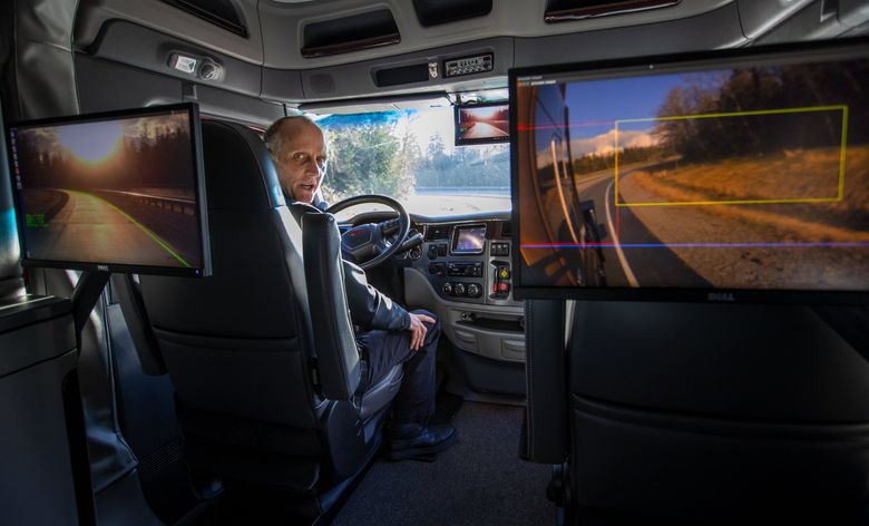 Chris Balton, lead automated driving engineer at Paccar’s Technical Center in Skagit County, drives this truck around a test track to demonstrate how technology guides the truck down the roadway. The monitors show how the truck sees the highway and surroundings. (Mike Siegel / The Seattle Times)