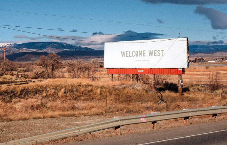 **EMBARGO: No electronic distribution, Web posting or street sales before Sunday 5:01 a.m. ET Feb. 23, 2020. No exceptions for any reasons. EMBARGO set by source.** A billboard on the south end of Cody, Wyo., greets travelers on their way into town, on Jan. 28, 2020. Last September, The Cody Enterprise reported that Kanye West bought a property called Monster Lake Ranch, about eight miles outside Cody. (Elliot Ross/The New York Times) XNYT70 XNYT70