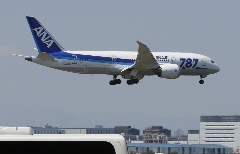 FILE – In this Sunday, April 28, 2013 file photo, a Boeing 787 plane of the All Nippon Airways, ANA, prepares to land after a test flight at Haneda Airport in Tokyo. Japanese carrier ANA is ordering 20 Boeing 787 Dreamliner jets, bringing its fleet of the planes to 103 by 2025. (AP Photo/Shizuo Kambayashi, File) BKWS201 BKWS201