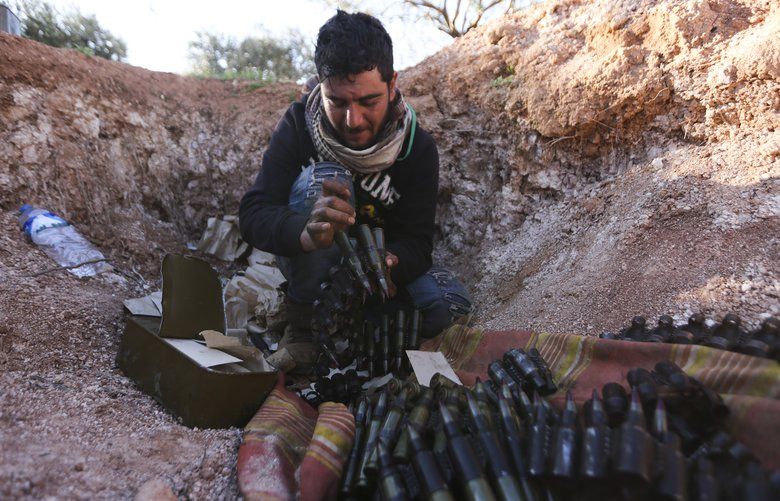 Turkish backed Syrian fighter loads ammunition at a frontline near the town of Saraqib in Idlib province, Syria, Wednesday, Feb. 26, 2020. Syrian government forces have captured dozens of villages, including major rebel strongholds, over the past few daysÂ in the last opposition-held area in the country’s northwest. (AP Photo/Ghaith Alsayed) DV101 DV101