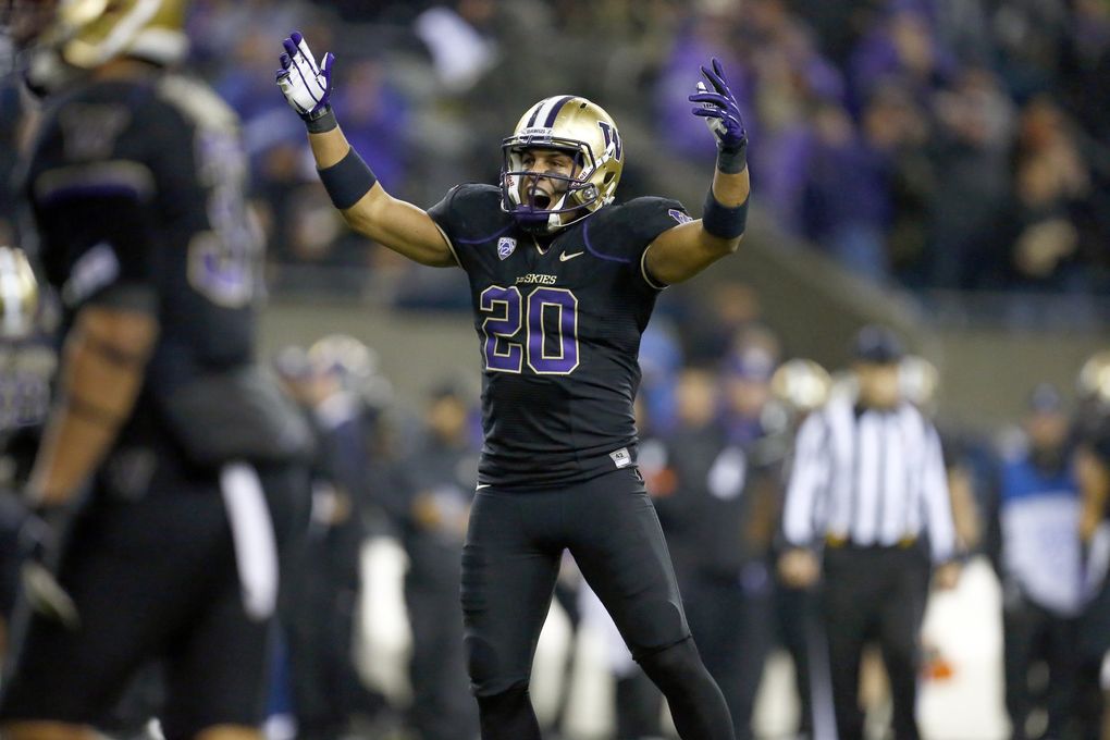 Washington safety Justin Glenn celebrates after intercepting a pass by Oregon State quarterback Sean Mannion in the first half at CenturyLink Field on Saturday, October 27, 2012, in Seattle, Wash. (John Lok / The Seattle Times)