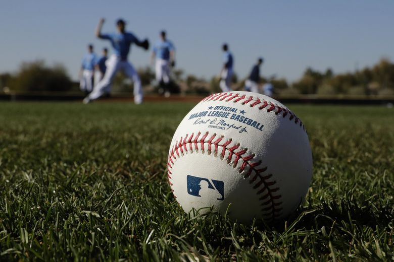 Seattle Mariners pitchers participate in a drill during spring training baseball practice Thursday, Feb. 13, 2020, in Peoria, Ariz. (AP Photo/Charlie Riedel) AZCR104 AZCR104 (Charlie Riedel / The Associated Press)