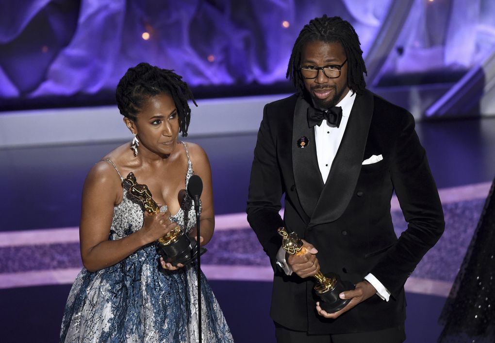 Karen Rupert Toliver, left, and Matthew A. Cherry accept the award for best animated short film for “Hair Love” at the Oscars on Sunday, Feb. 9, 2020, at the Dolby Theatre in Los Angeles. (AP Photo/Chris Pizzello) CADC207 CADC207 (Chris Pizzello / Chris Pizzello/Invision/AP)