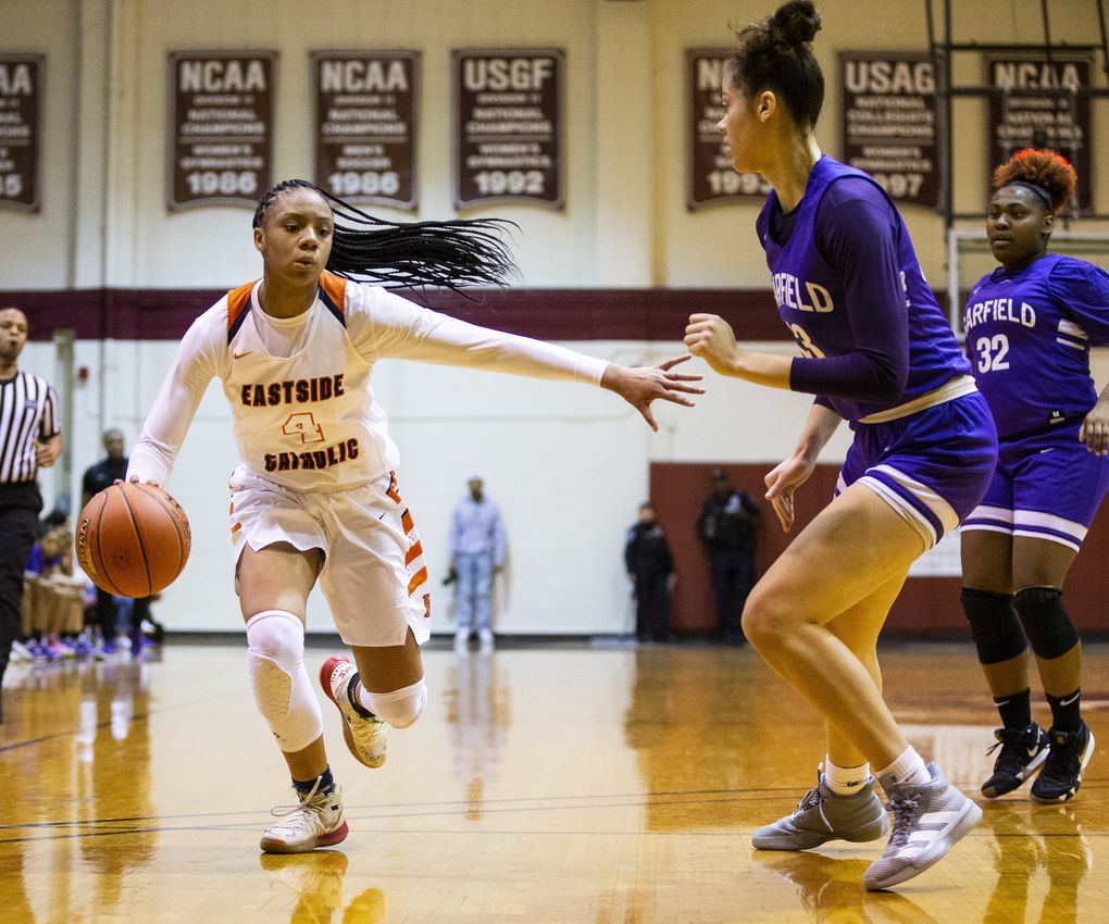 Eastside Catholic freshman Mjracle Sheppard takes the ball to the basket in a game in the Metro League title game. (Amanda Snyder / The Seattle Times)