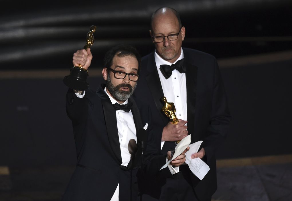 Andrew Buckland, left, and Michael McCusker accept the award for best film editing for “Ford v Ferrari” at the Oscars on Sunday, Feb. 9, 2020, at the Dolby Theatre in Los Angeles. (AP Photo/Chris Pizzello) CADC333 CADC333 (Chris Pizzello / Chris Pizzello/Invision/AP)