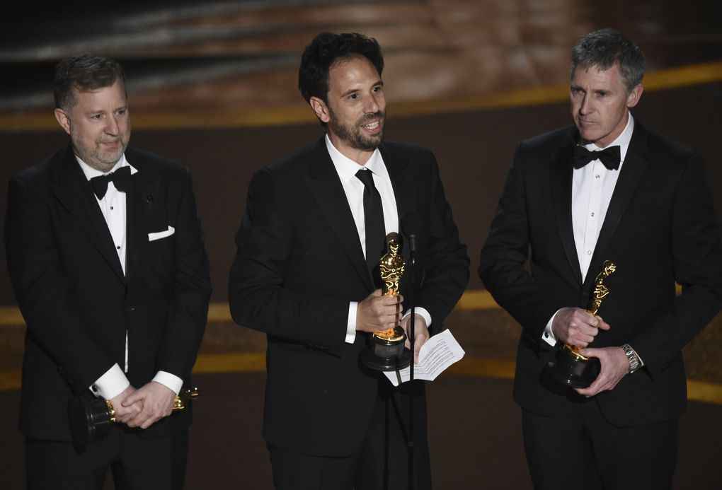 Greg Butler, from left, Guillaume Rocheron and Dominic Tuohy accept the award for best visual effects for “1917” at the Oscars on Sunday, Feb. 9, 2020, at the Dolby Theatre in Los Angeles. (AP Photo/Chris Pizzello) CADC348 CADC348 (Chris Pizzello / Chris Pizzello/Invision/AP)