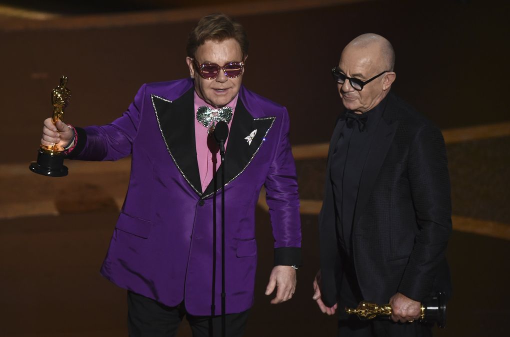 Elton John, left, and Bernie Taupin accept the award for best original song for “(I’m Gonna) Love Me Again” from “Rocketman” at the Oscars on Sunday, Feb. 9, 2020, at the Dolby Theatre in Los Angeles. (AP Photo/Chris Pizzello) CADC375 CADC375 (Chris Pizzello / Chris Pizzello/Invision/AP)