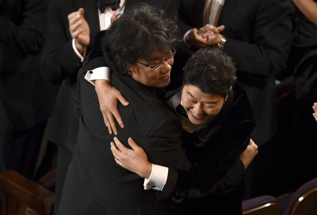 Bong Joon Ho, left, and Kang-Ho Song celebrate before going on stage to accept the award for best picture for “Parasite”at the Oscars on Sunday, Feb. 9, 2020, at the Dolby Theatre in Los Angeles. (AP Photo/Chris Pizzello) CADC417 CADC417 (Chris Pizzello / Chris Pizzello/Invision/AP)