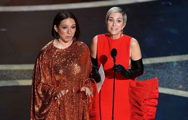 Maya Rudolph, left, and Kristen Wiig speak onstage during the 92nd Annual Academy Awards at Dolby Theatre on February 09, 2020 in Hollywood, California. (Kevin Winter/Getty Images/TNS) 1568103 1568103