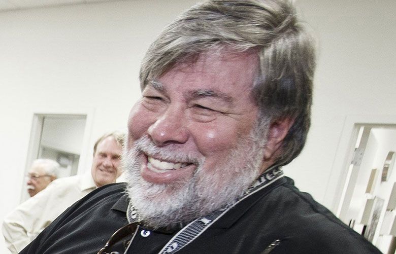 Steve Wozniak, co-founder of Apple, poses behind five Apple 1 computers in 2013 at History San Jose in California. (TNS file photo by Dai Sugano / San Jose Mercury News)