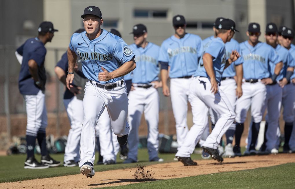 Jarred Kelenic runs home during baserunning drills on Feb. 20 at Mariners’ spring-training camp in Peoria, Ariz. (Dean Rutz / The Seattle Times)