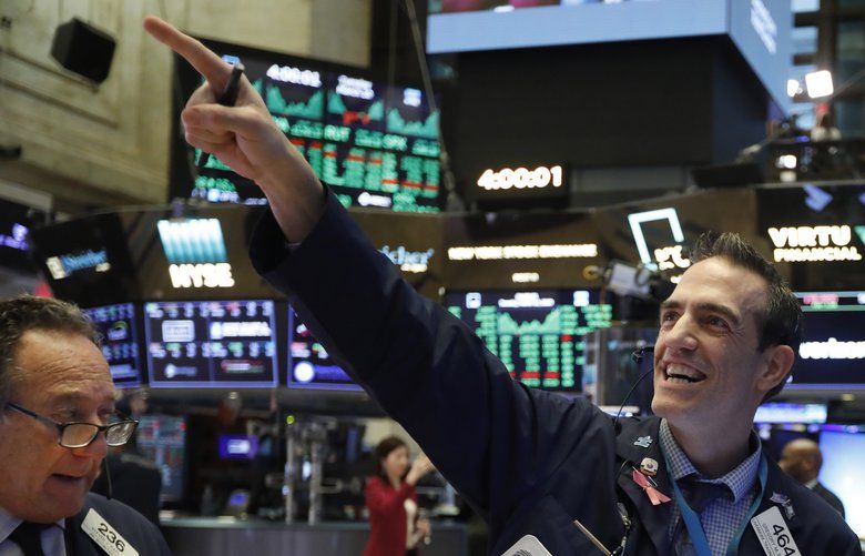 Traders Steven Kaplan, left, and Gregory Rowe react at the closing on the floor of the New York Stock Exchange, Tuesday, March 10, 2020. Stocks are closing sharply higher on Wall Street Tuesday, adding 4.9% to major indexes, as hopes build for a greater response from the Trump administration to the economic threat from the coronavirus outbreak. (AP Photo/Richard Drew) NYRD115 NYRD115