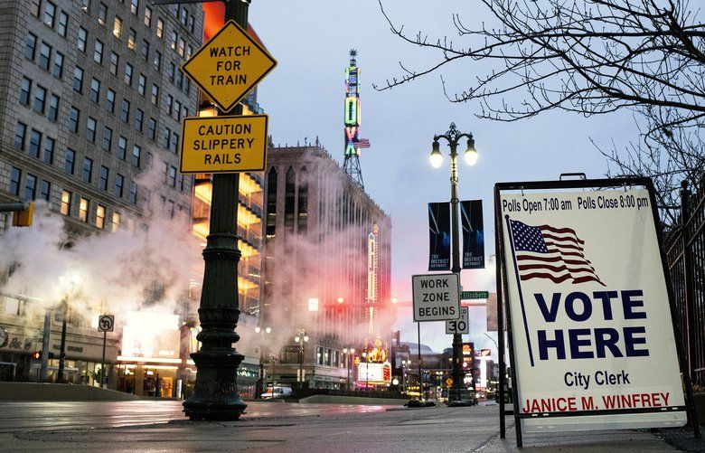 A sign directs primary voters to a polling place in downtown Detroit on Tuesday morning, March 10, 2020. Former Vice President Joe Biden and Sen. Bernie Sanders (I-Vt.) are competing fiercely over Democratic voters in the crucial Midwestern state, which is one of six nominating contests on Tuesday. (Brittany Greeson/The New York Times) XNYT13 XNYT13