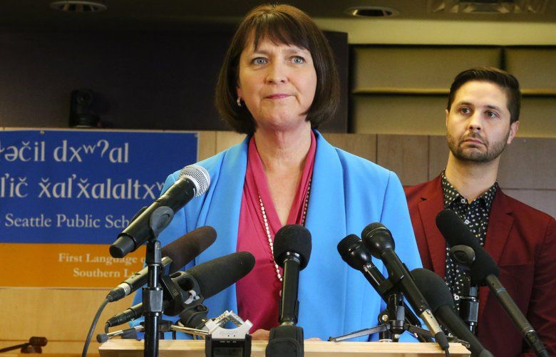 Seattle Public Schools Superintendent Denise Juneau, left, takes questions after announcing school closures for a minimum of 14 calendar days due to factors surrounding the coronavirus, Wednesday, March 11, 2020 in Seattle. At right is Seattle School Board President Zachary DeWolf. 213315