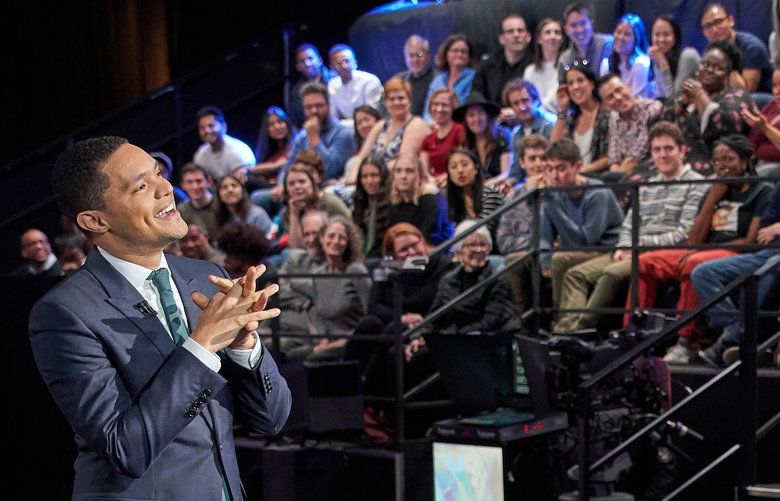 This undated image shows host Trevor Noah with his audience during a taping of “The Daily Show with Trevor Noah.” The show, along with other New York-based late night talk shows “The Tonight Show Starring Jimmy Fallon” and “The Late Show with Stephen Colbert” will tape their shows without studio audiences due to the new coronavirus. For most people, the new coronavirus causes only mild or moderate symptoms. For some it can cause more severe illness. (Comedy Central via AP) NYET351 NYET351