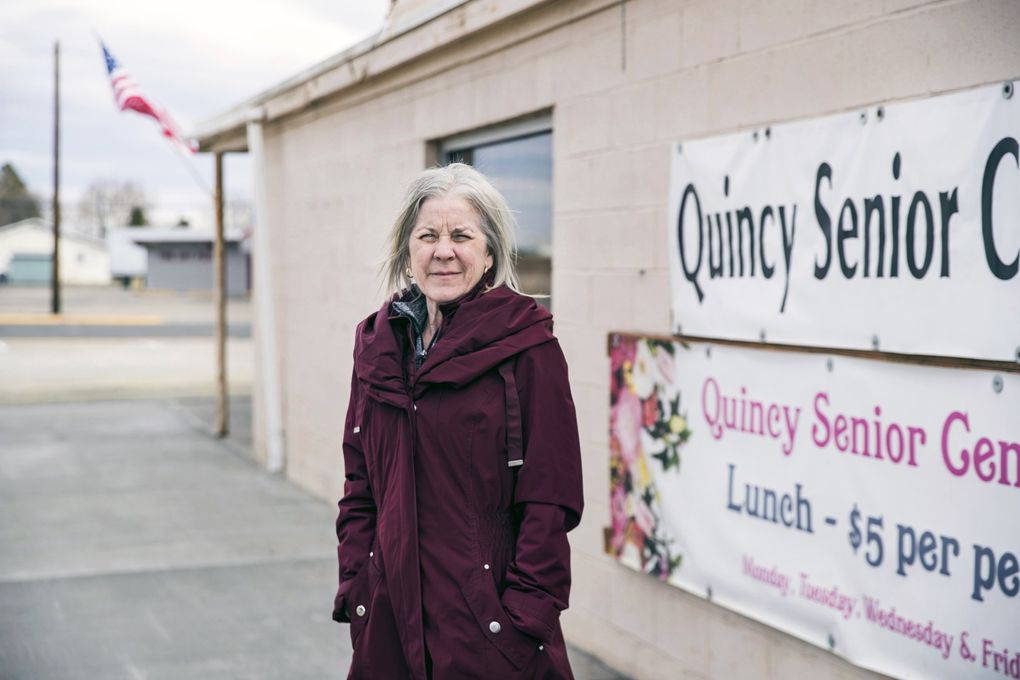 Stacia Soukup, director of Quincy Senior Center, is looking forward to the day when this building can reopen and serve as a community gathering place. The center shut down after one of its members died March 7 from the novel coronavirus. Soukup grieves the loss amid concerns that the virus could spread among the center’s elderly members.
(Amanda Snyder / The Seattle Times)