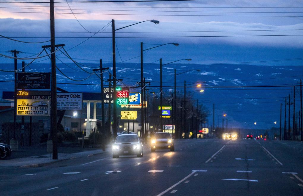 Cars drive down State Route 28, the main road that cuts through Quincy, Wash., in Grant County. The rural county recently experienced its first death. from the novel coronavirus Public health officials are investigating how it got there and if anyone else was exposed. (Amanda Snyder / The Seattle Times)