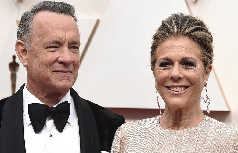 FILE – In this Feb. 9, 2020 file photo, Tom Hanks, left, and Rita Wilson arrive at the Oscars at the Dolby Theatre in Los Angeles. The couple have tested positive for the coronavirus, the actor said in a statement Wednesday, March 11. The 63-year-old actor said they will be “tested, observed and isolated for as long as public health and safety requires.” (Photo by Jordan Strauss/Invision/AP, File) NYR116 NYR116