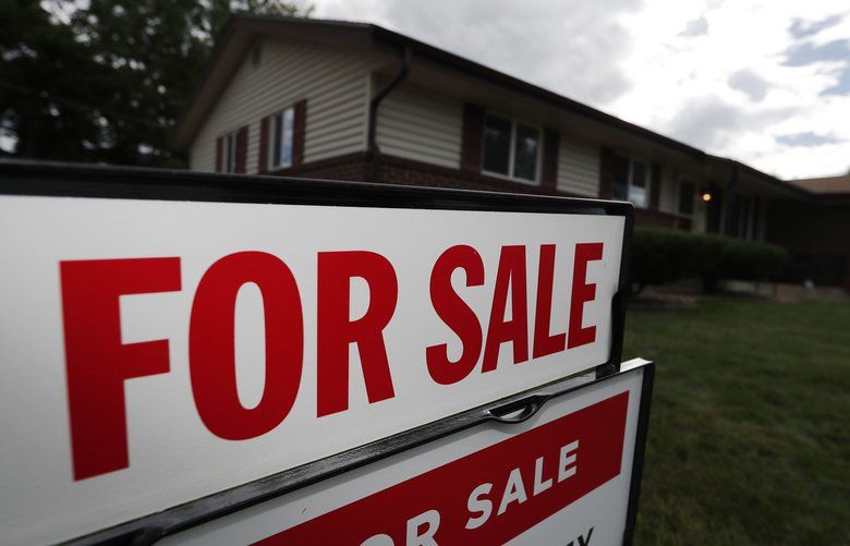 A for sale sign stands outside a home on the market in the north Denver suburb of Thornton, Colo. The Standard & Poor’s/Case-Shiller 20-city home price index for November is released. (AP Photo/David Zalubowski, File) NYBZ211