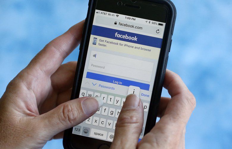 FILE – In this Aug. 21, 2018, file photo, a Facebook start page is shown on a smartphone in Surfside, Fla. Facebook says a bug in its anti-spam system is blocking the publication of links to news stories about the coronavirus. (AP Photo/Wilfredo Lee, File) NYSB236 NYSB236
