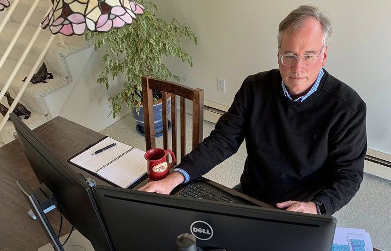 Craig Davenport, president of the MZA Architecture firm in Bellevue, works from home during the coronavirus outbreak. He typically commutes from Mukilteo and had been resistant to allowing employees to telework, but is adjusting out of necessity.