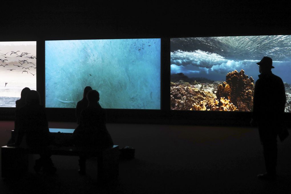 “Vertigo Sea” (2015) is one of three works that comprise “John Akomfrah: Future History,” which opened March 5 at Seattle Art Museum. (Ken Lambert / The Seattle Times)