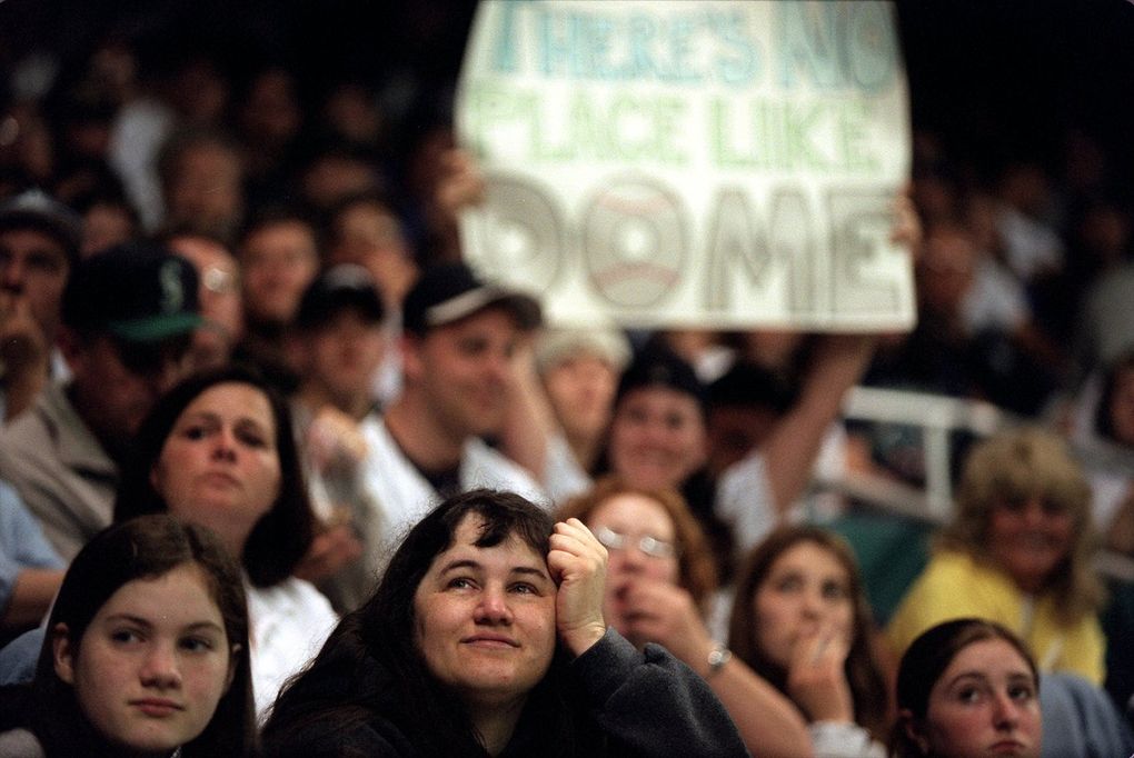 Sentimental music and nostalgic video shots brought tears to the eyes of Tara Melcher of Bellevue at the last Mariners’ game in the Kingdome. “I remember when they built it,” she said. (Mike Barkin / The Seattle Times)