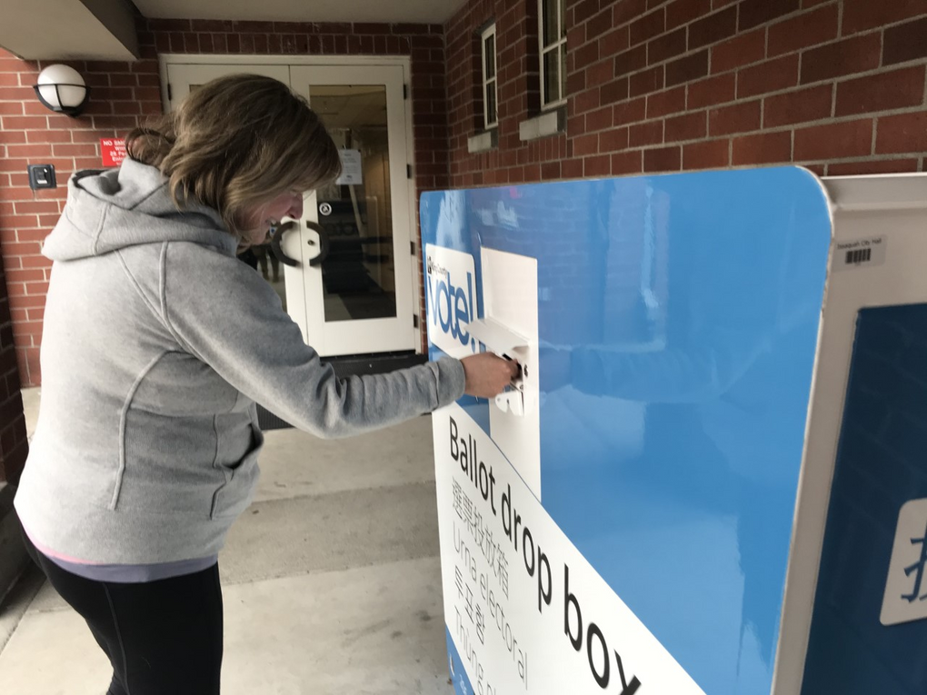 Voting in Issaquah during the 2020 presidential primary. (Paige Cornwell / The Seattle Times)