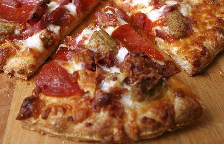 An Aug. 9, 2007 file photo shows a cooked frozen pizza. (AP Photo/Larry Crowe) FRA114