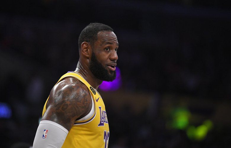 Los Angeles Lakers forward LeBron James stands on the court during the first half of an NBA basketball game against the Philadelphia 76ers Tuesday, March 3, 2020, in Los Angeles. (AP Photo/Mark J. Terrill) NYOTK NYOTK