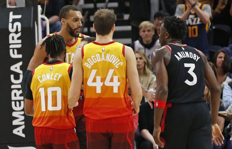 Utah Jazz center Rudy Gobert, rear, is separated from Toronto Raptors forward OG Anunoby (3) in the second half of an NBA basketball game, Monday, March 9, 2020, in Salt Lake City. (AP Photo/Rick Bowmer) UTRB128 UTRB128
