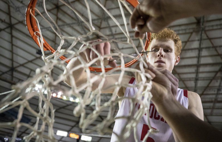 Mt. Si’s Jabe Mullins cuts downt he net after the Wildcats defeated Central Valley 58-47 to win the 4A State Title.

Mt. Si and Central Valley met in the finals of 4A Boys Basketball Saturday, March 7, 2020 at the Tacoma Dome. 213261