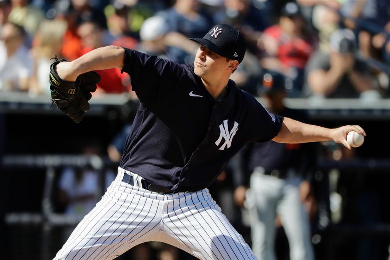 New York Yankees pitcher Zack Britton walks off the field after