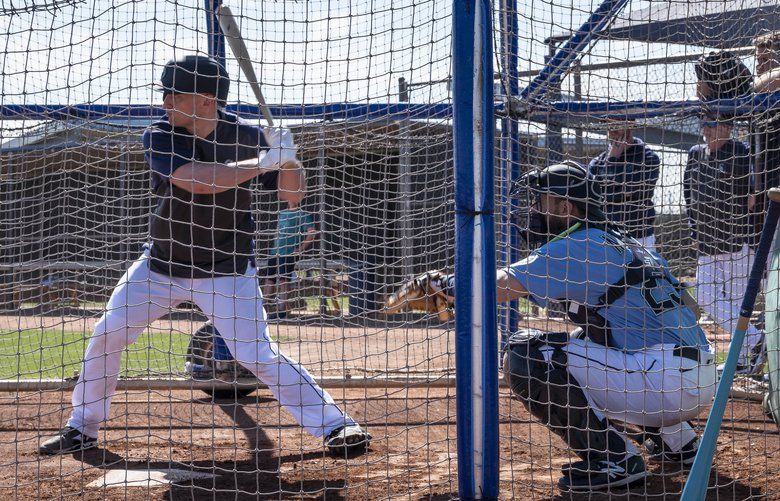 Mariners hitting coach Tim Laker trying from afar to keep players in