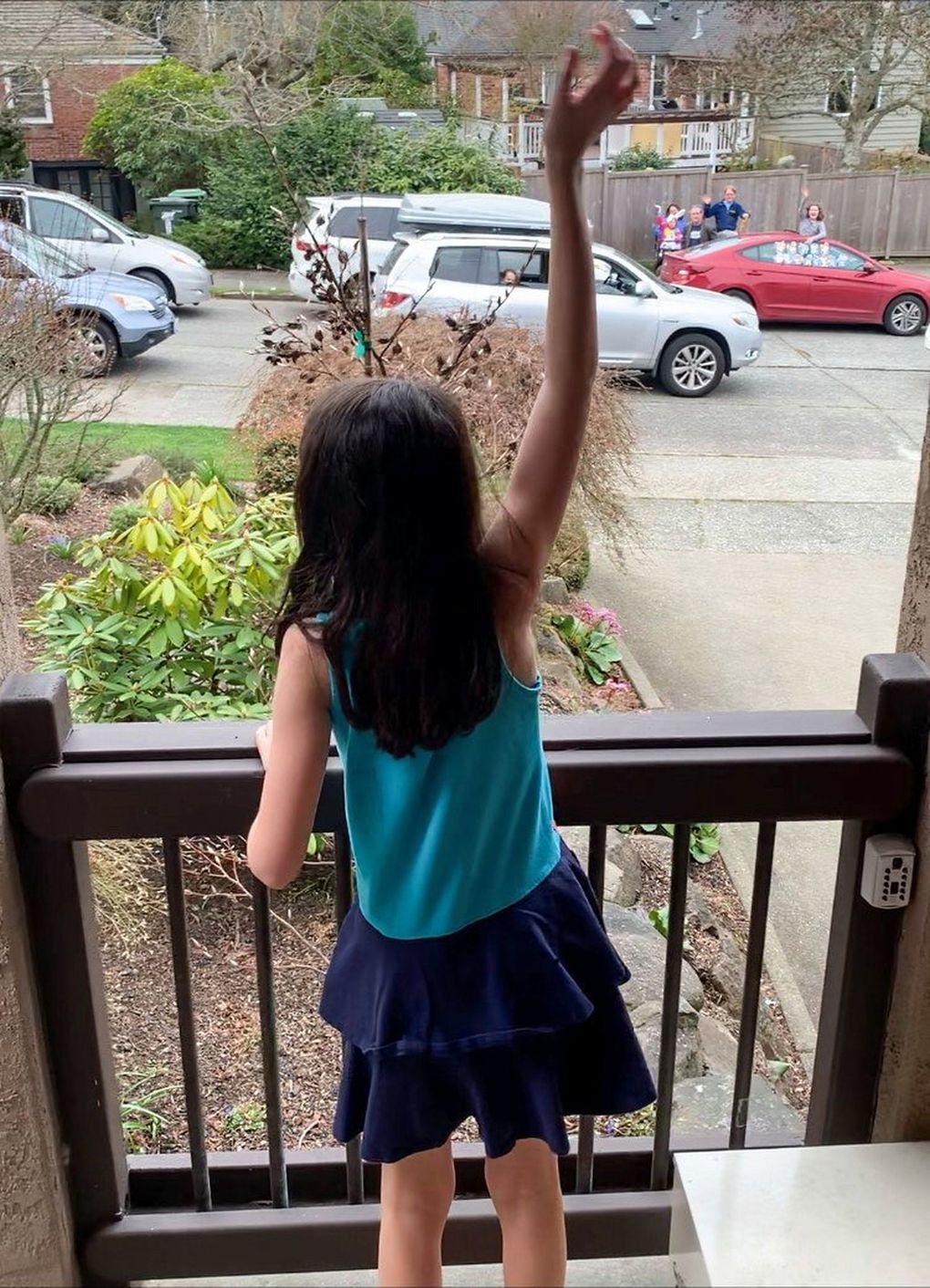 Hannah Bruno waves to her friends taking part in a car parade to wish her happy birthday last month. (Courtesy of Carrie Bruno)