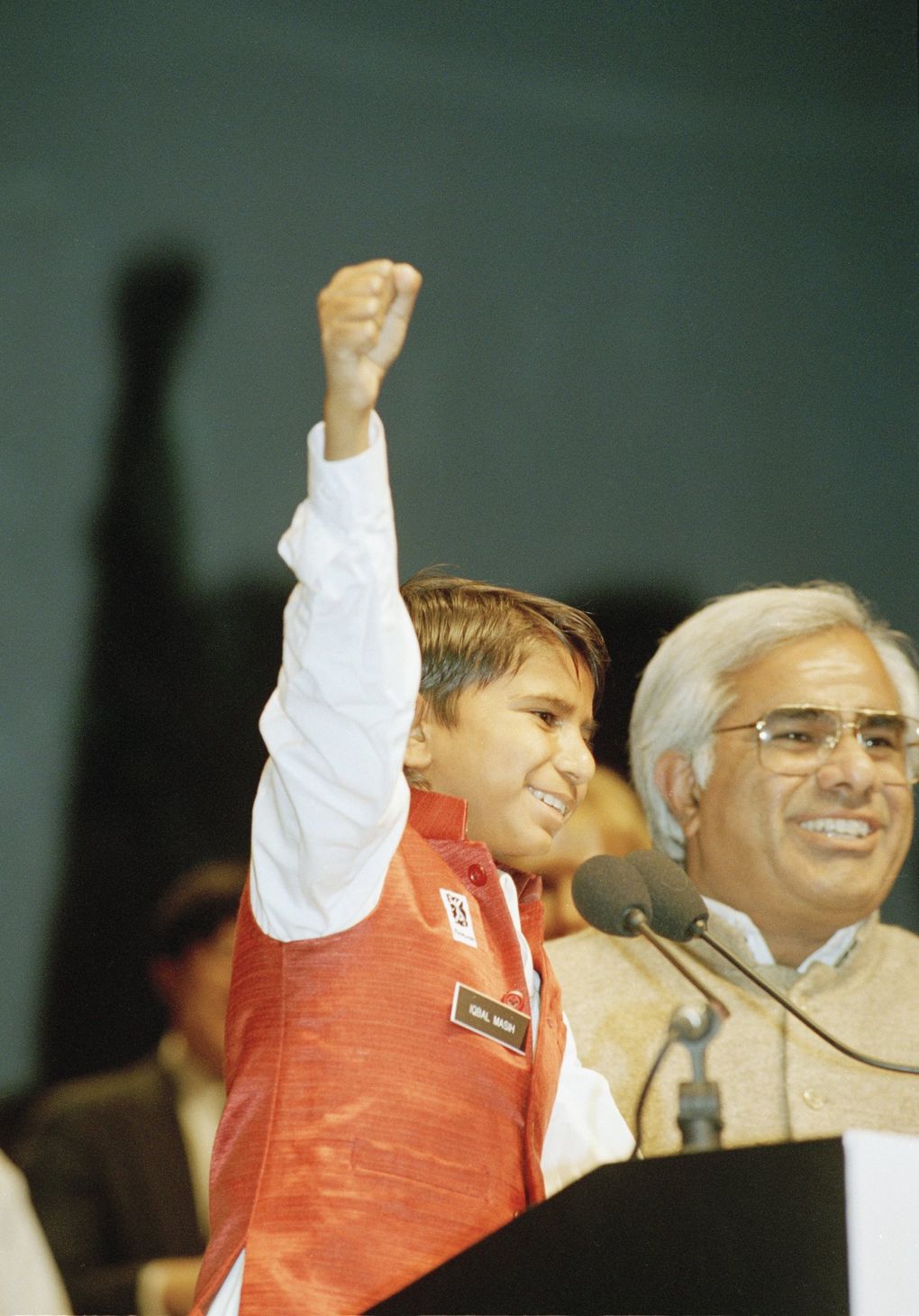 Twelve-year-old Iqbal Masih, of Pakistan, who was forced into slave labor at a carpet factory at age 4, is introduced as one of five recipients to receive a Reebok Human Rights Award in 1994 in Boston. (Steven Senne / The Associated Press)