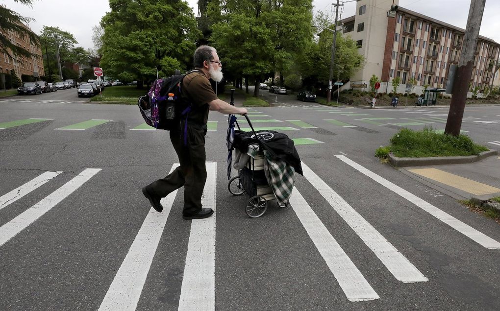 Joe Bernstein has been living on the street for eight years. On this day, he was walking from Cowen Park to the University of Washington campus and the University District. (Alan Berner / The Seattle Times)