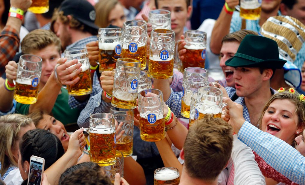 FILE – In this Sept. 19, 2015 file photo, people celebrate the opening of the 182nd Oktoberfest beer festival in Munich, southern Germany. Bavarian state governor Markus Soeder and Munich mayor Dieter Reiter announced at a news conference that the Oktoberfest is cancelled again this year because of the coronavirus outbreak. (AP Photo/Matthias Schrader, file)