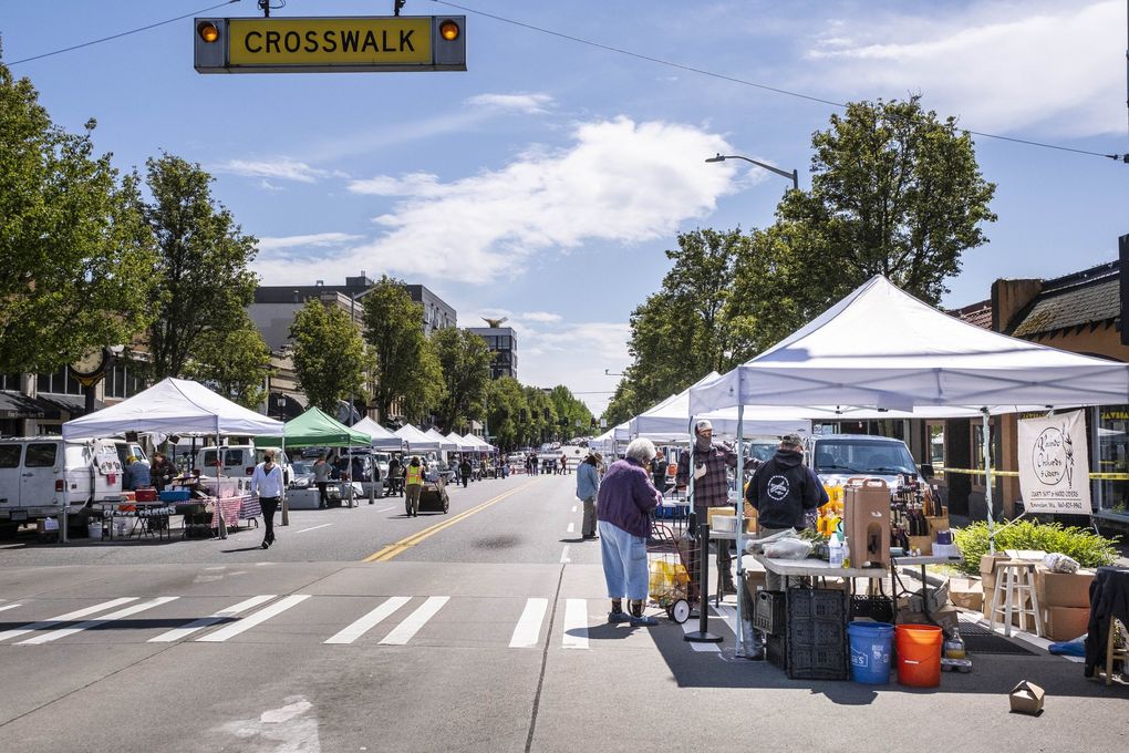 The West Seattle Farmers Market opened for the first time this year under strict guidelines for merchants and social distancing Sunday. There were 969 people officially counted into the market, one of two markets in Seattle to have opened, though on a week-by-week basis, according to Sarah Schu of Neighborhood Farmers Market Alliance, which manages seven farmers markets in the city. The five others have no confirmed dates on which they might reopen. (Dean Rutz / The Seattle Times)
Photographed Sunday, May3, 2020. 213879 (Dean Rutz / The Seattle Times)