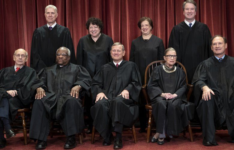 FILE – In this Nov. 30, 2018, file photo, the justices of the U.S. Supreme Court gather for a formal group portrait to include a new Associate Justice, top row, far right, at the Supreme Court Building in Washington. Seated from left: Associate Justice Stephen Breyer, Associate Justice Clarence Thomas, Chief Justice of the United States John G. Roberts, Associate Justice Ruth Bader Ginsburg and Associate Justice Samuel Alito Jr. Standing behind from left: Associate Justice Neil Gorsuch, Associate Justice Sonia Sotomayor, Associate Justice Elena Kagan and Associate Justice Brett M. Kavanaugh. (AP Photo/J. Scott Applewhite, File) WX303 WX303