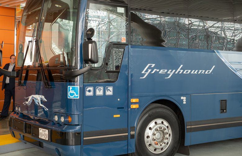 A Greyhound intercity bus with passengers boarding for service on Aug. 11, 2018 in San Francisco, Calif. Greyhound will require passengers to wear face coverings on its buses, starting May 13, as a precaution against the spread of COVID-19. (David Tran/Dreamstime/TNS) 1656965 1656965