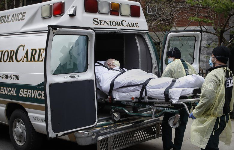 FILE – In this April 17, 2020, file photo, a patient is loaded into an ambulance by emergency medical workers outside Cobble Hill Health Center in the Brooklyn borough of New York. New York state is now reporting more than 1,700 previously undisclosed deaths at nursing homes and adult care facilities as the state faces scrutiny over how itâ€™s protected vulnerable residents during the coronavirus pandemic. (AP Photo/John Minchillo, File) NYCD401 NYCD401