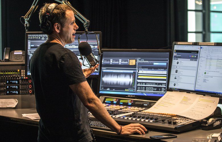 Thursday, March 26, 2020   John Richards, KEXP morning show host working in the main DJ booth during his show.  KEXP broadasts have remained a rare stable/normal presence in listeners’ lives.