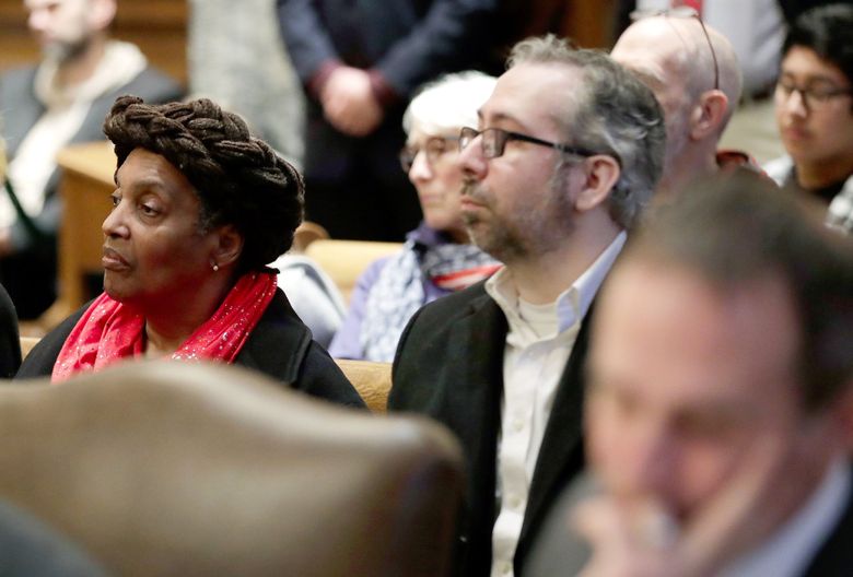 2016 Washington state electoral college representatives Esther John, center, and Bret Chiafalo, right, sit behind their attorneys during a previous Washington Supreme Court hearing in Olympia on  whether presidential electors can vote for whomever they choose, regardless of which candidate was chosen by state voters.
 (Ted S. Warren / The Associated Press, file)
