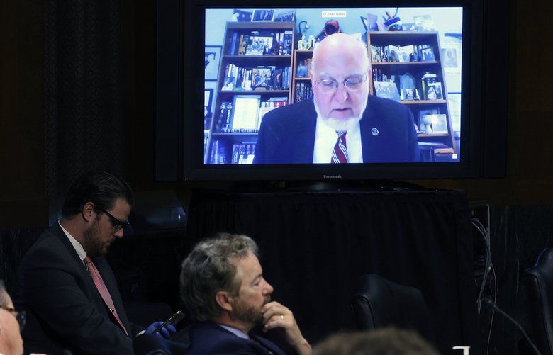 U.S. Senators listen to Dr. Robert Redfield, director of the Centers for Disease Control and Prevention, speak from a remote location, during a Senate Committee for Health, Education, Labor, and Pensions hearing on the coronavirus response, in Washington, Tuesday, May 12, 2020. (Win McNamee via The New York Times) — FOR EDITORIAL USE ONLY — XNYT36 XNYT36