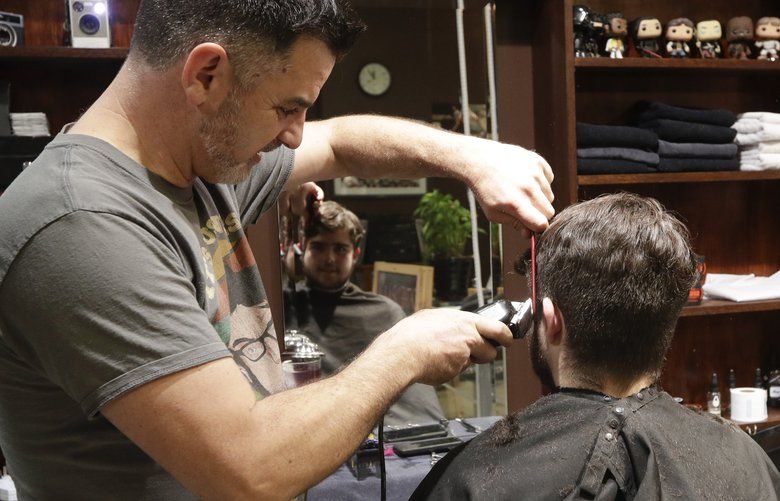 New Zealand barber snips away at midnight as nation reopens The