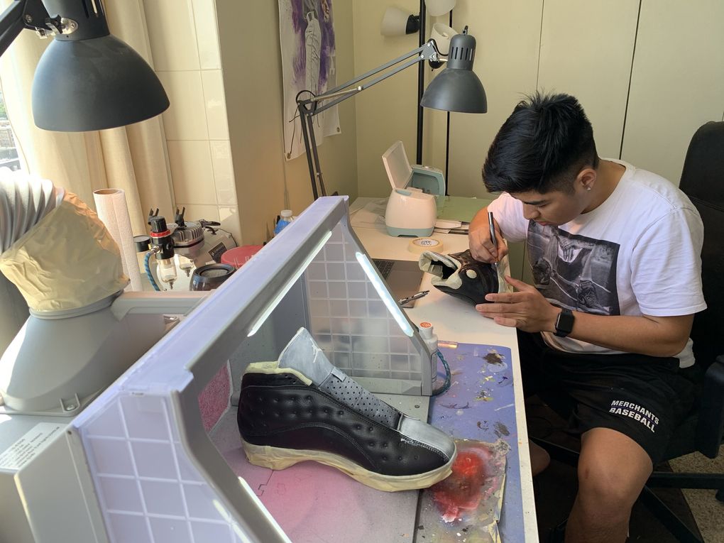 University of Washington freshman Andrew Urrutia works on cleats for Adam Jones, a baseball player in Japan, at his home workshop. (Andrew Urrutia collection)